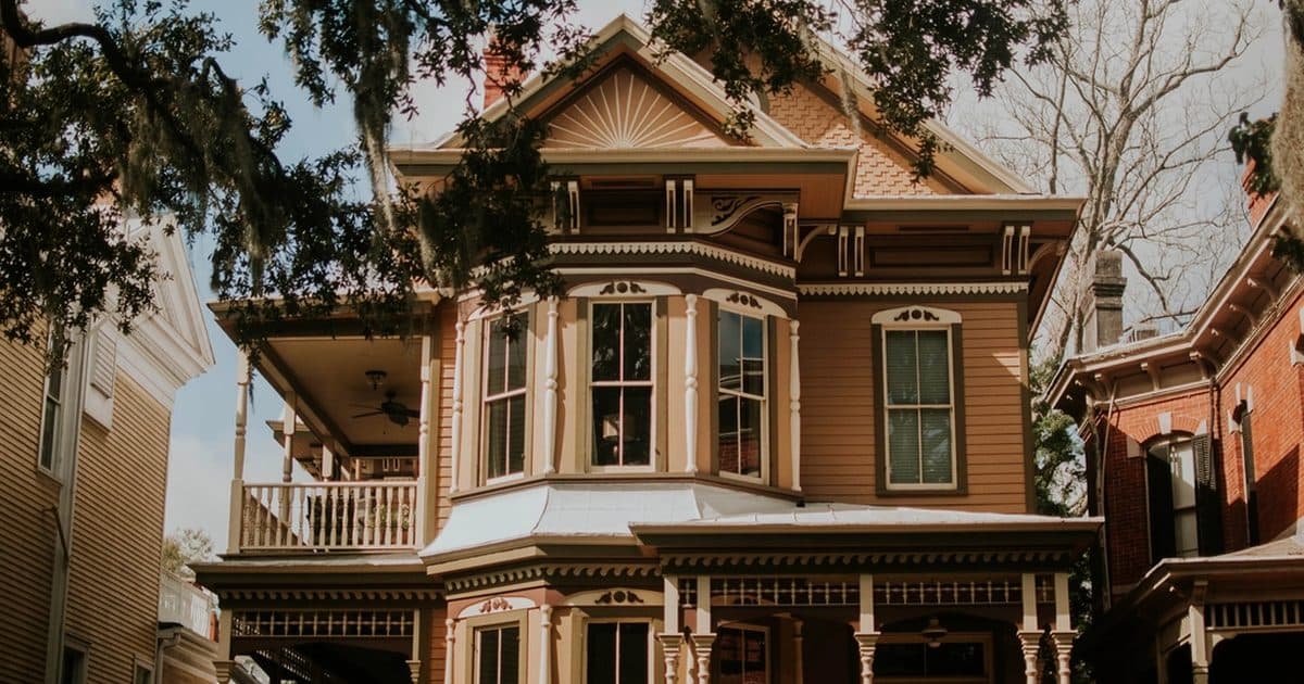A Victorian house with a wraparound porch