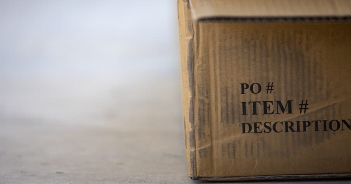 A cardboard shipping box labeled with item numbers